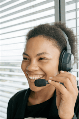 woman smiling while on the phone